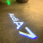 LUCES DE PROYECTOR LOGO AUDI No 120 (cantidad 1 = 2 películas con logotipo / 2 luces de puerta)