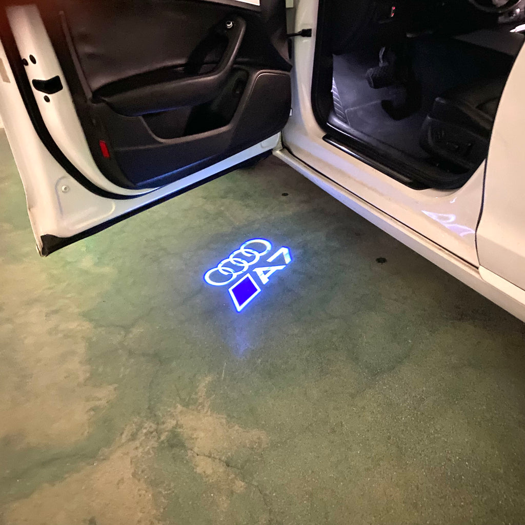 LUCES DE PROYECTOR LOGO AUDI No 120 (cantidad 1 = 2 películas con logotipo / 2 luces de puerta)