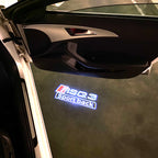 LUCES DE PROYECTOR LOGO AUDI No 120 (cantidad 1 = 2 películas con logotipo / 2 luces de puerta)