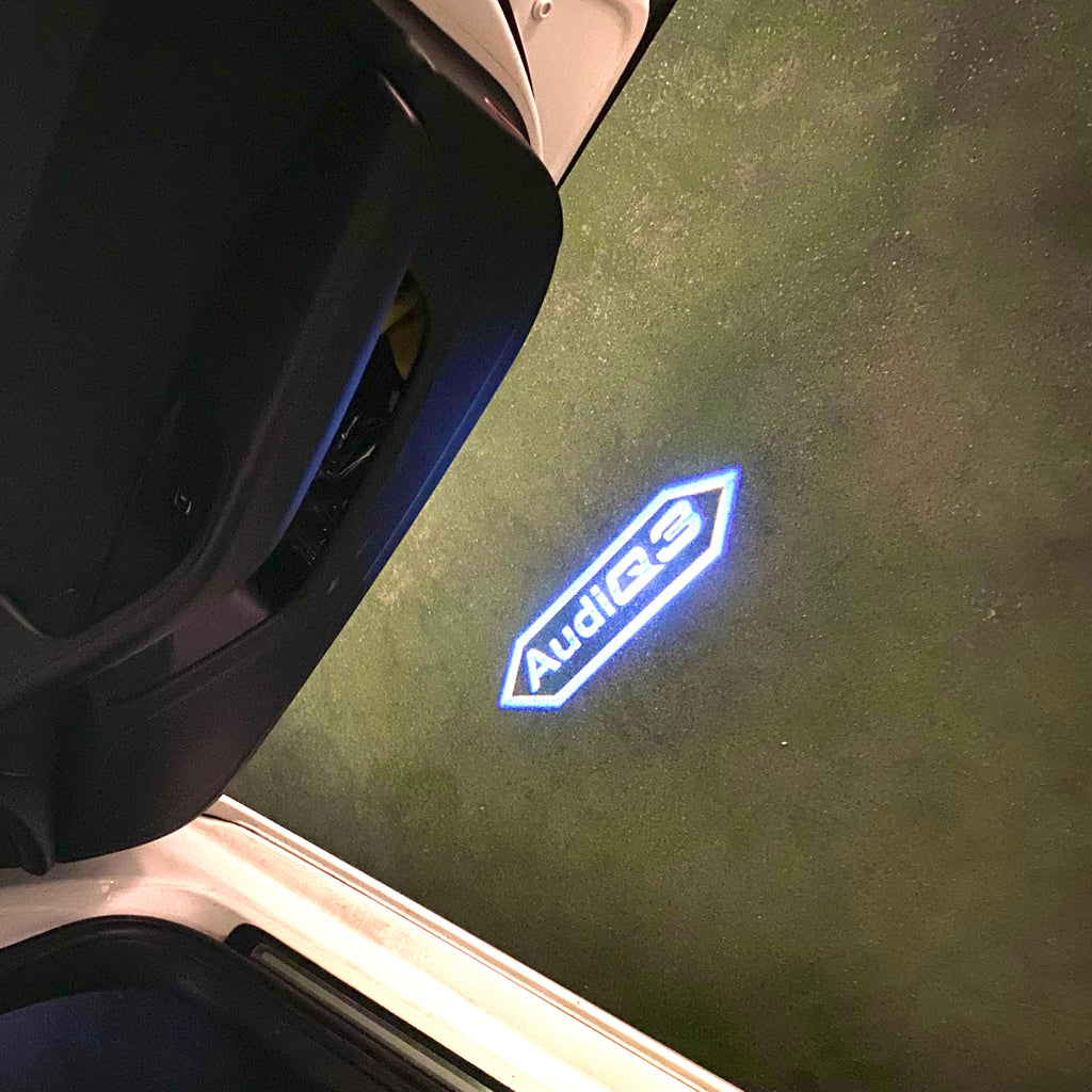 LUCES DE PROYECTOR LOGO AUDI No 120 (cantidad 1 = 2 películas con logotipo / 2 luces de puerta)