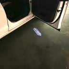 LUCES DE PROYECTOR LOGO AUDI No 120 (cantidad 1 = 2 películas con logotipo / 2 luces de puerta)