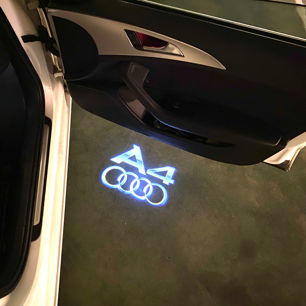 LUCES DE PROYECTOR LOGO AUDI No 120 (cantidad 1 = 2 películas con logotipo / 2 luces de puerta)