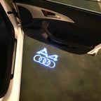 LUCES DE PROYECTOR LOGO AUDI No 120 (cantidad 1 = 2 películas con logotipo / 2 luces de puerta)