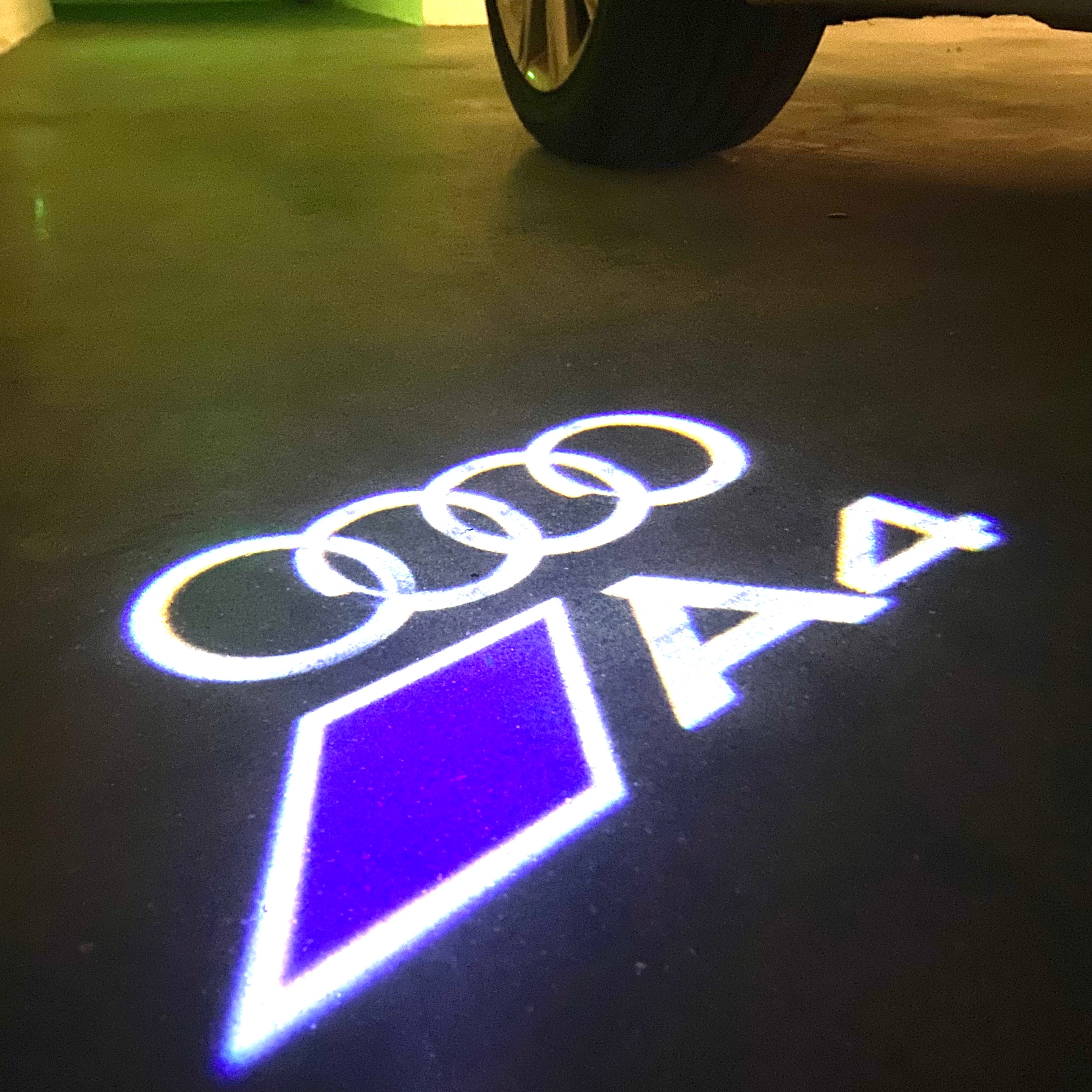 LUCES DE PROYECTOR LOGO AUDI No 120 (cantidad 1 = 2 películas con logotipo / 2 luces de puerta)
