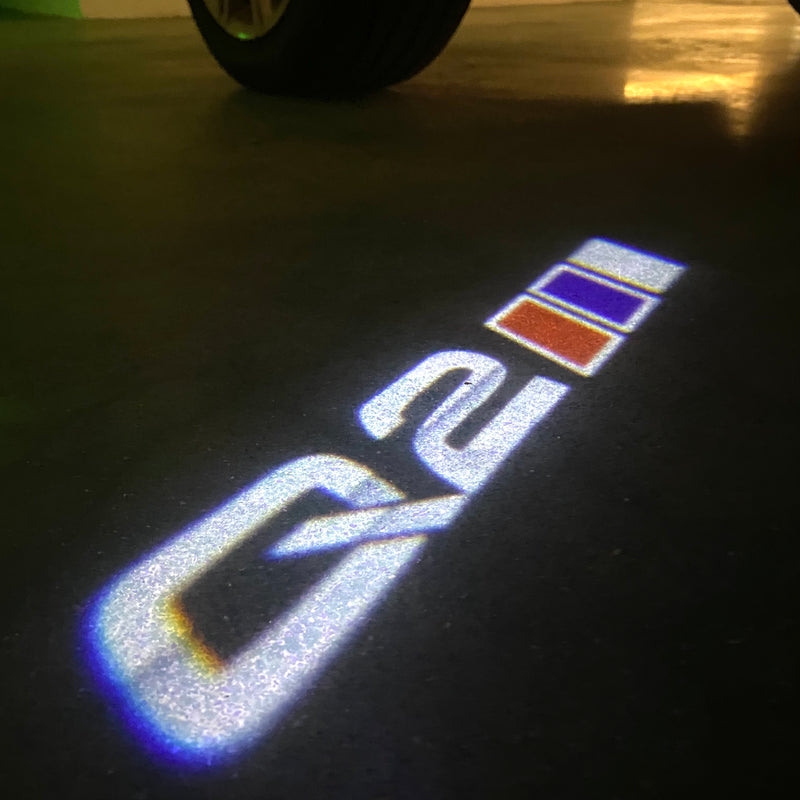 LUCES DE PROYECTOR LOGO AUDI No 120 (cantidad 1 = 2 películas con logotipo / 2 luces de puerta)