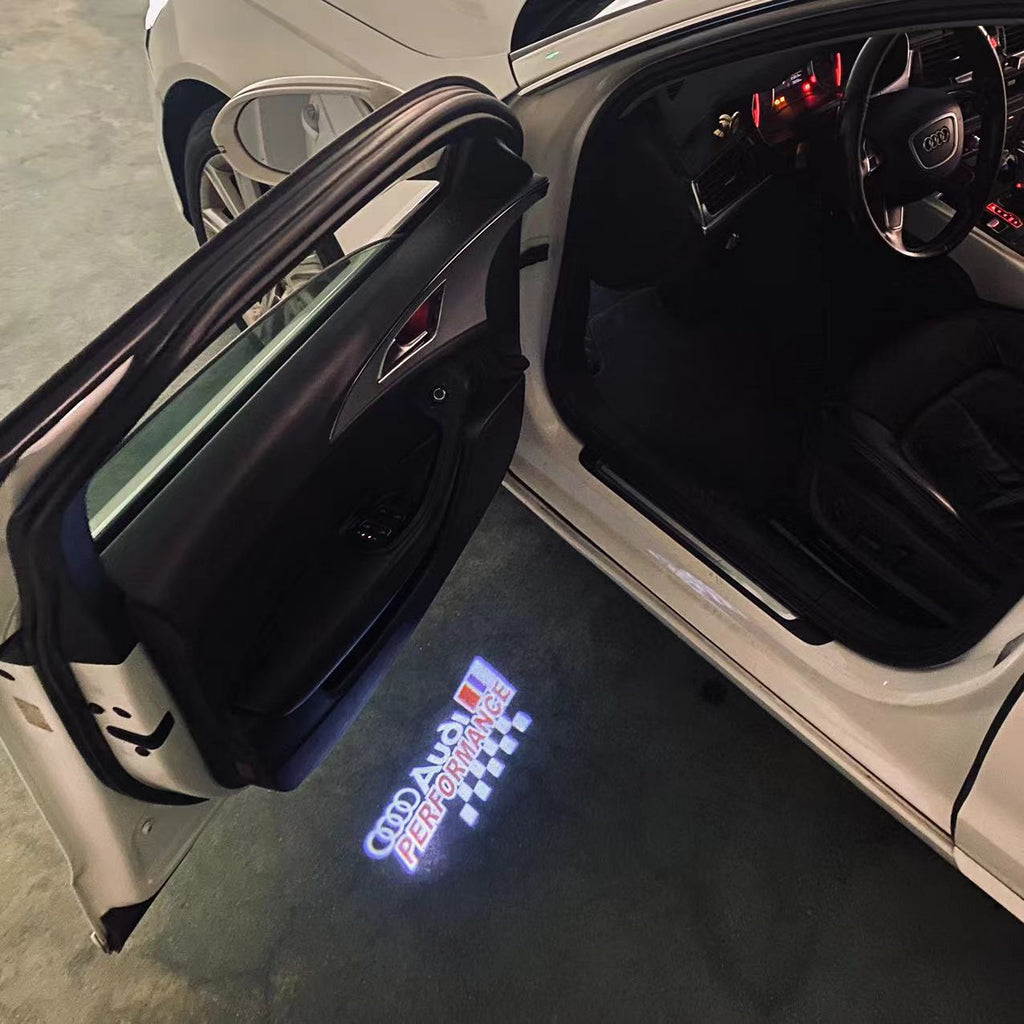 LUCES DE PROYECTOR LOGO AUDI No 120 (cantidad 1 = 2 películas con logotipo / 2 luces de puerta)