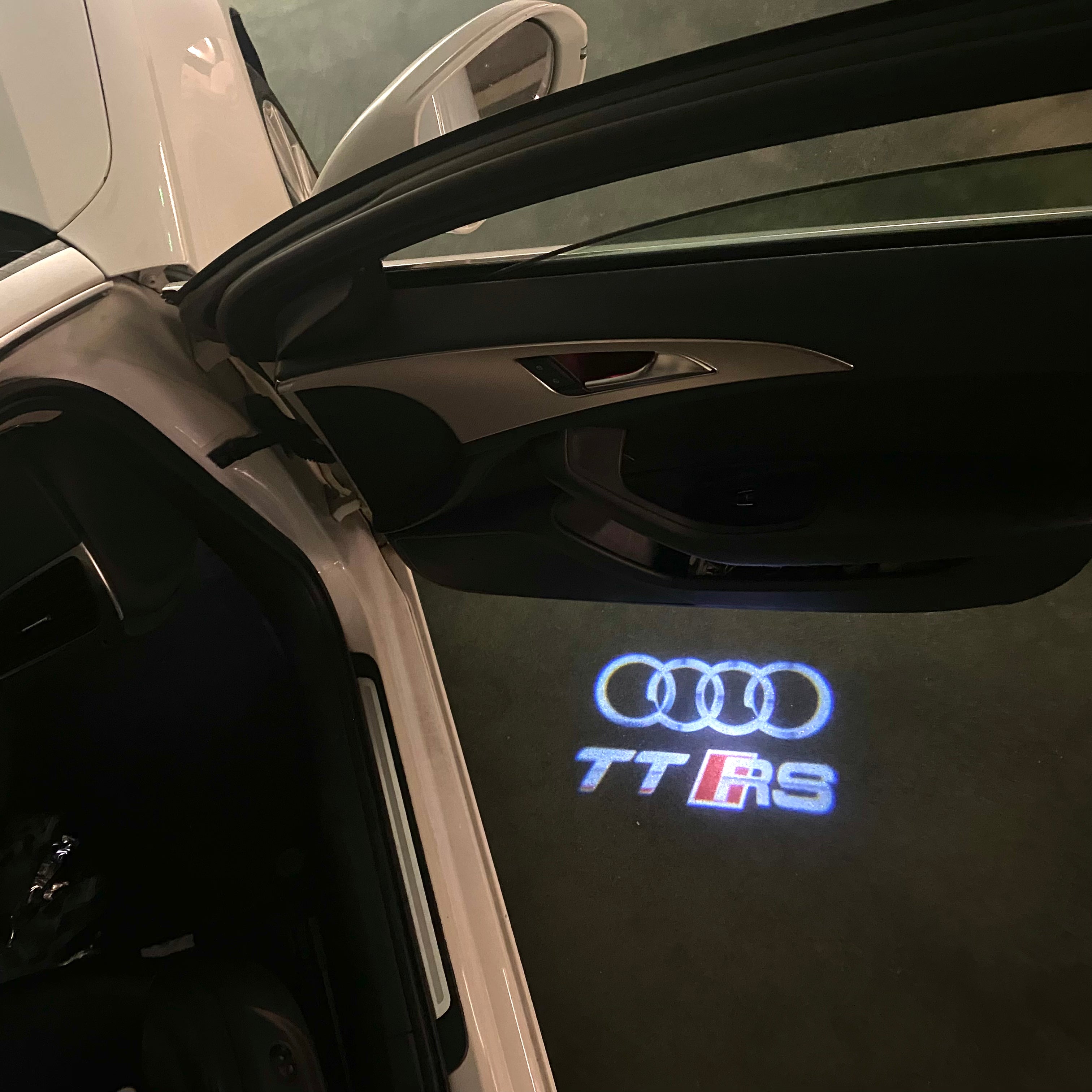AUDI  TTRS LOGO PROJECTOT LIGHTS  (quantity 1 = 2 Logo Films /2 door lights）Nr.12B50