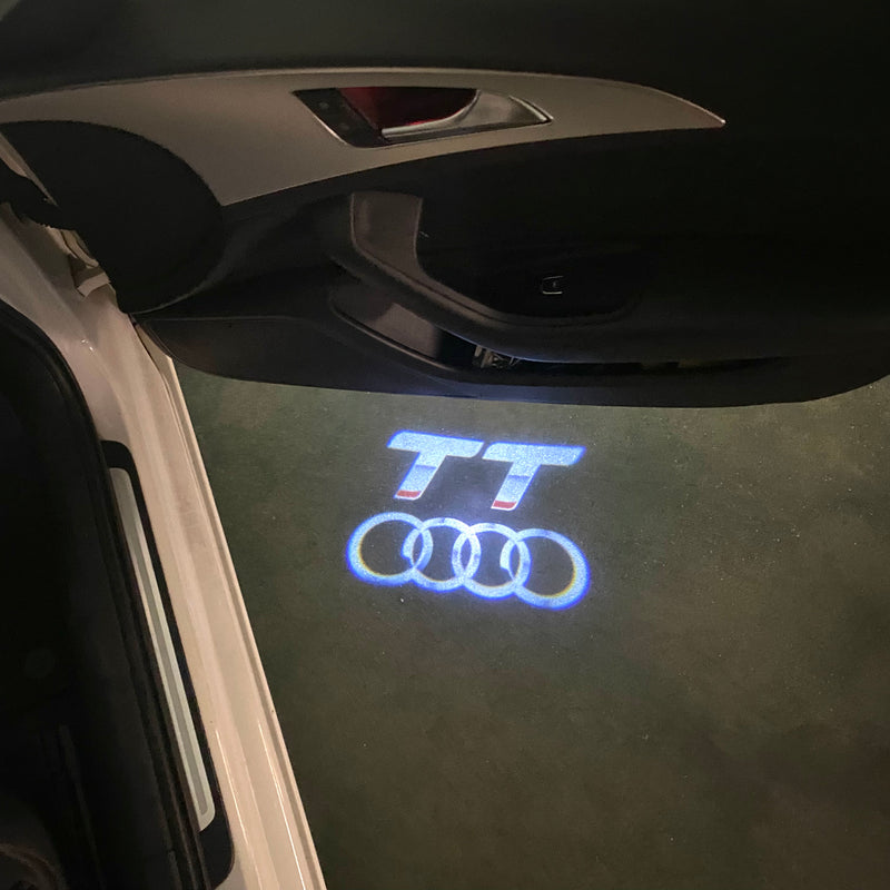 LUCES DE PROYECTOR LOGO AUDI No 120 (cantidad 1 = 2 películas con logotipo / 2 luces de puerta)