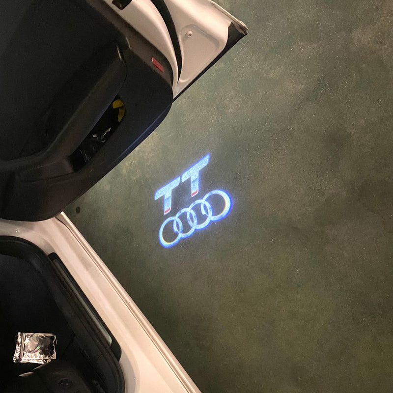 LUCES DE PROYECTOR LOGO AUDI No 120 (cantidad 1 = 2 películas con logotipo / 2 luces de puerta)