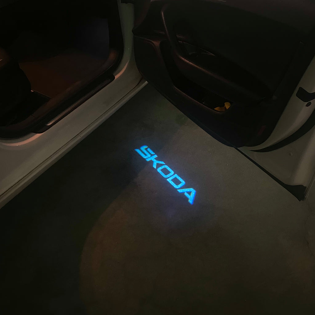 SKODA ORIGINAL LOGO PROJECTOT LIGHTS Nr.857(quantity  1 =  2 Logo Film /  2 door lights)