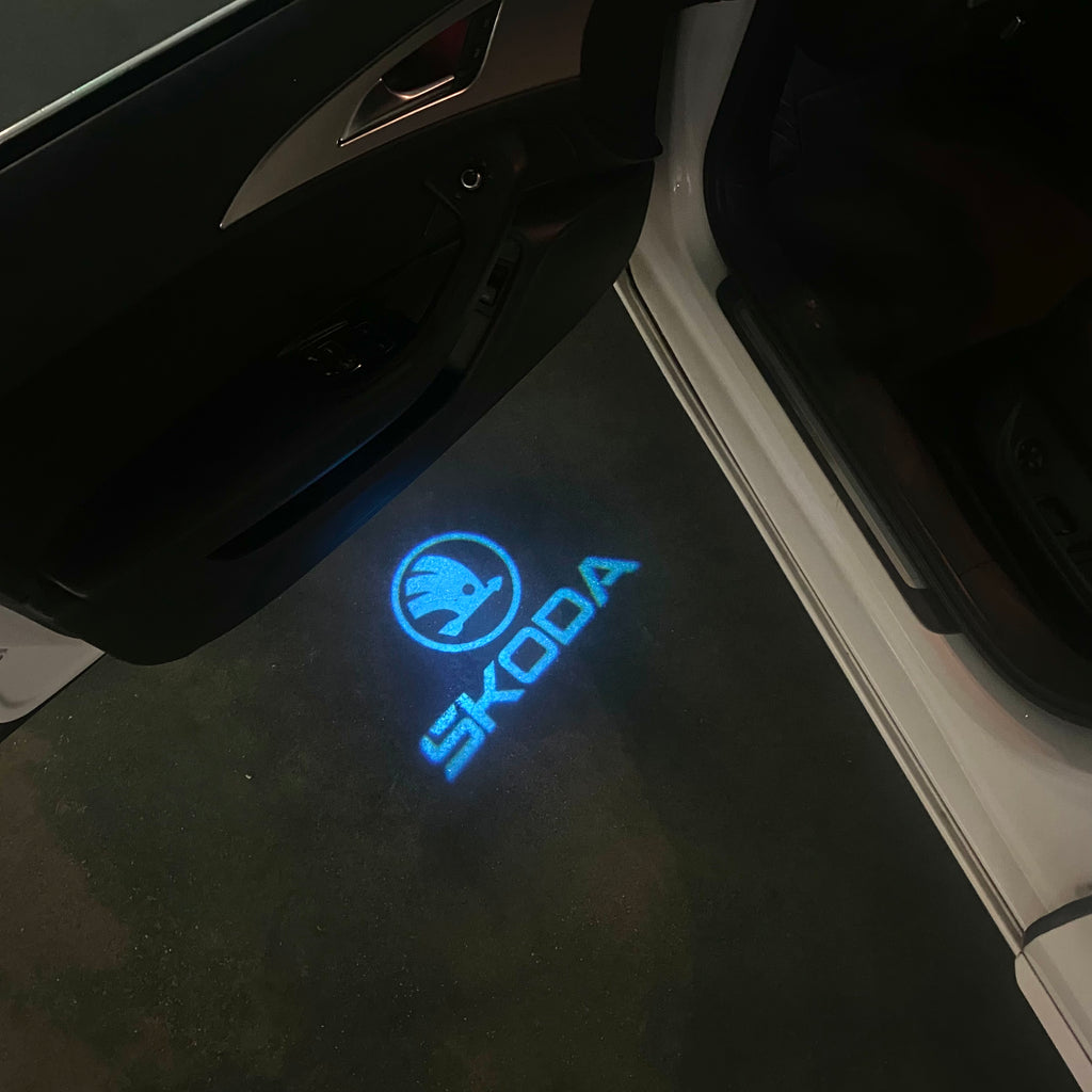 SKODA ORIGINAL LOGO PROJECTOT LIGHTS Nr.867(quantity  1 =  2 Logo Film /  2 door lights)