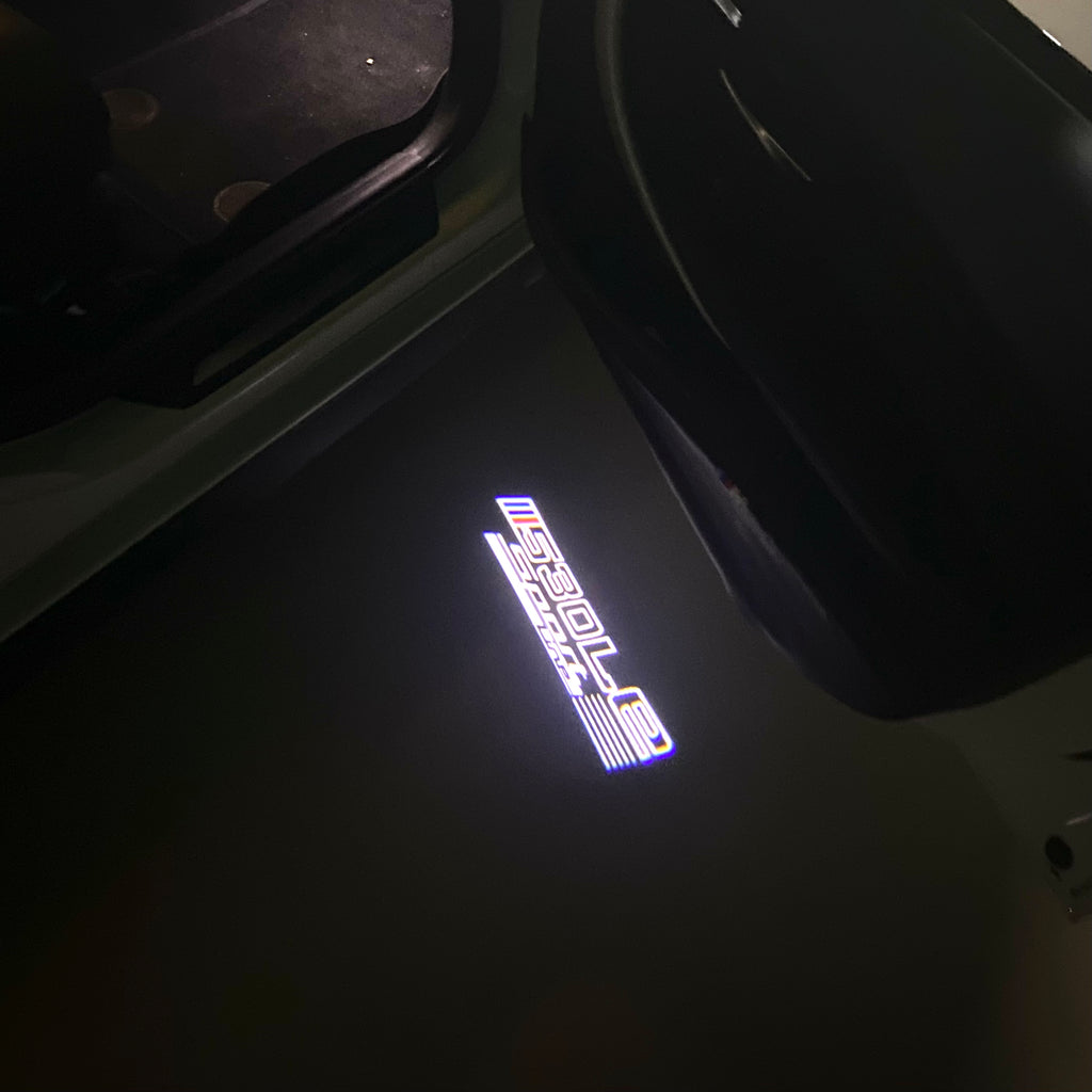 ÉCLAIRAGE DE PROJECTEUR BMW M3 LOGO Nr.24 (quantité 1 = 1 jeux / 2 feux de porte)