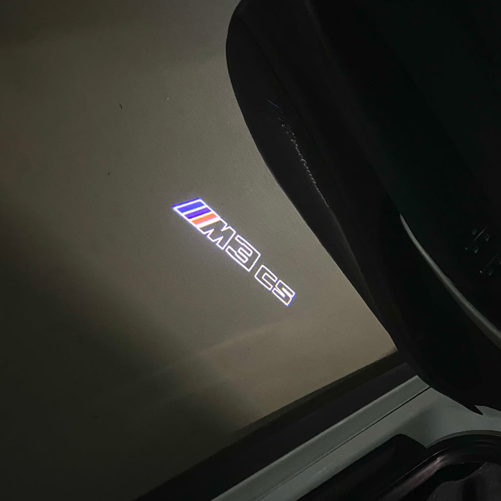 ÉCLAIRAGE DE PROJECTEUR BMW M3 LOGO Nr.24 (quantité 1 = 1 jeux / 2 feux de porte)