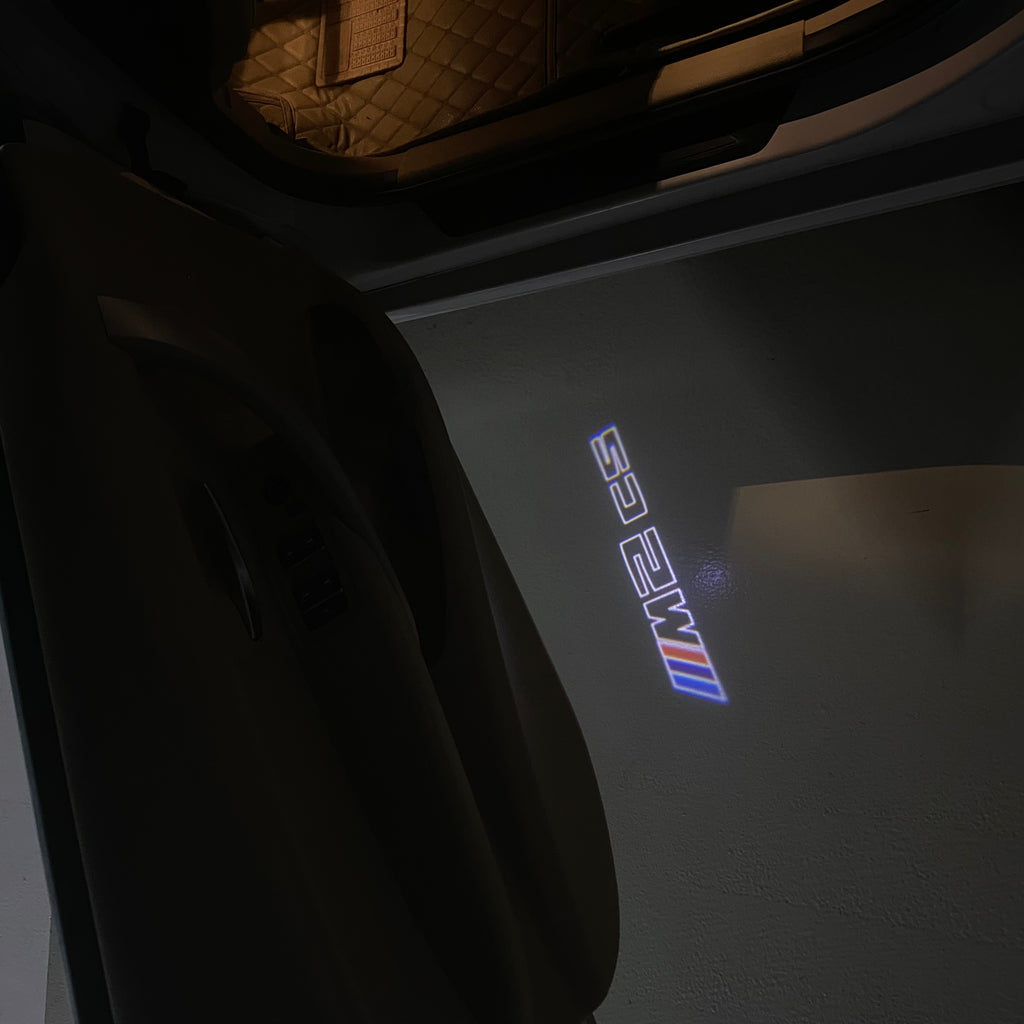 ÉCLAIRAGE DE PROJECTEUR BMW M3 LOGO Nr.24 (quantité 1 = 1 jeux / 2 feux de porte)