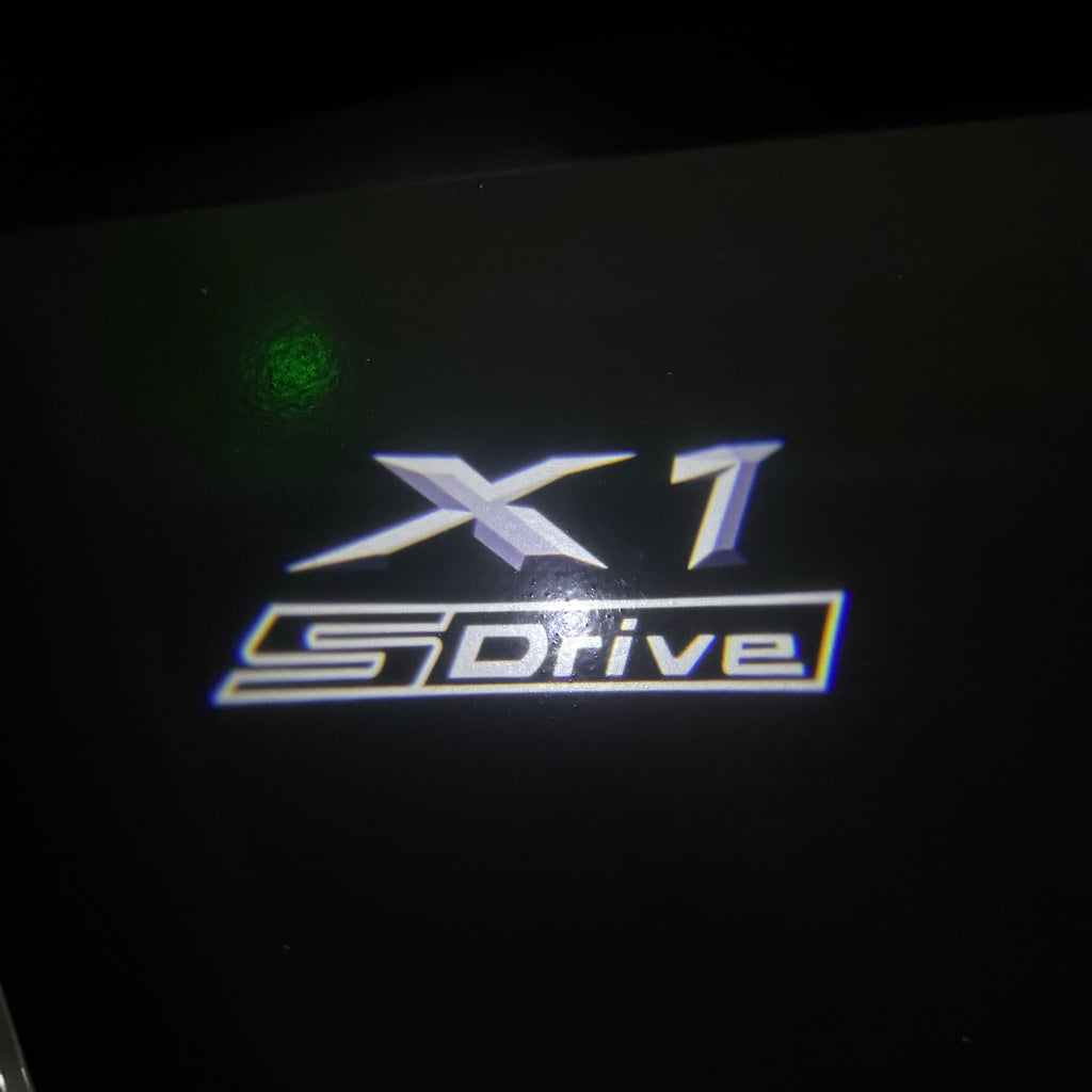 BMW X1 S Drive   LOGO PROJECTOT LIGHTS (quantity 1 = 1 sets/2 door lights) Nr.6024q05