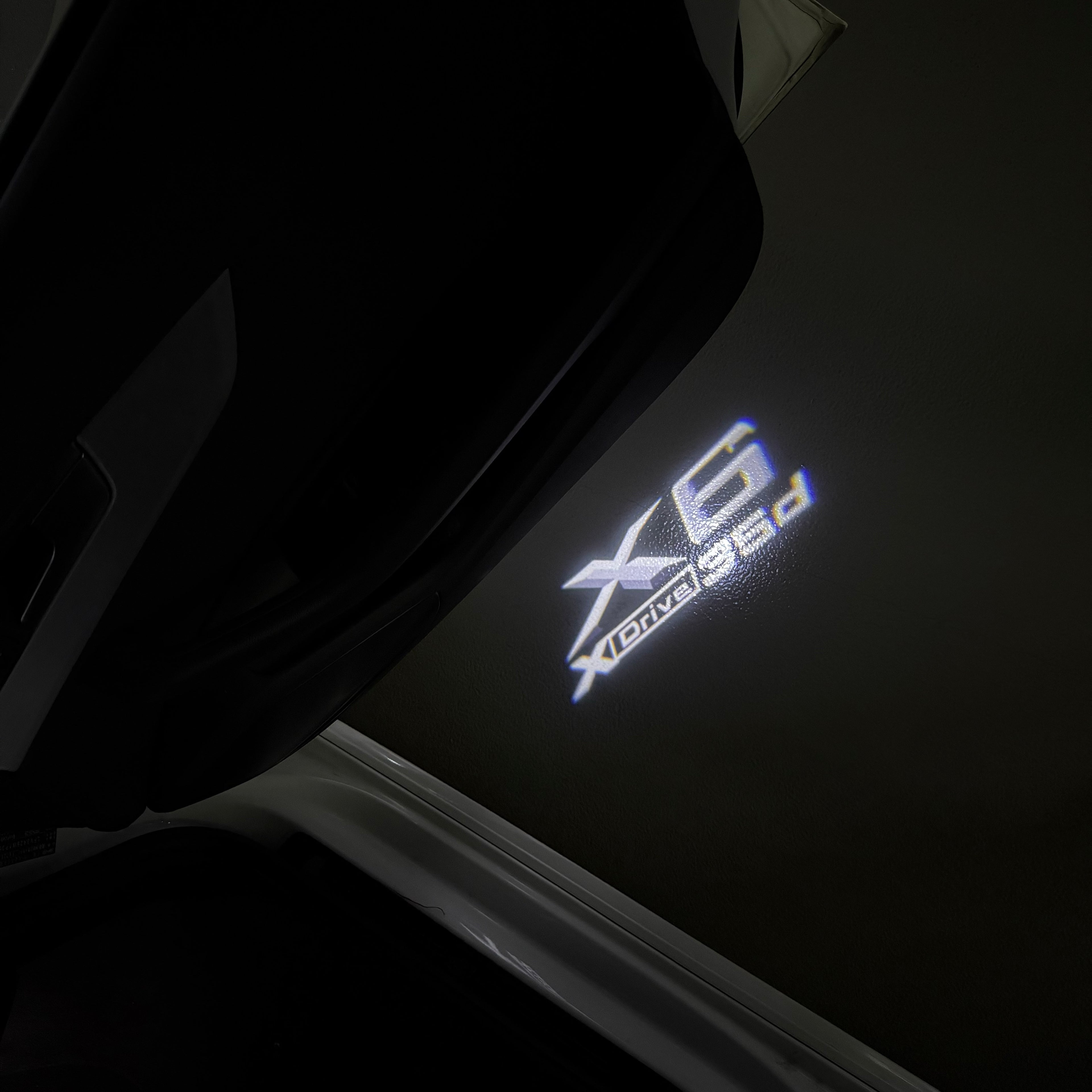 BMW  X6 Xdrive LOGO PROJECTOT LIGHTS (quantity 1 = 1 sets/2 door lights) Nr.6024q0t0104