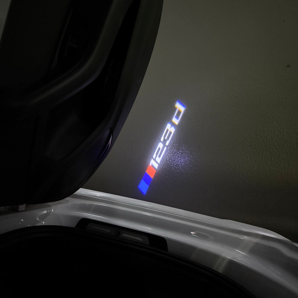 BMW 1 SERIES  123  LOGO PROJECTOT LIGHTS (quantity 1 = 1 sets/2 door lights) Nr.6024q16