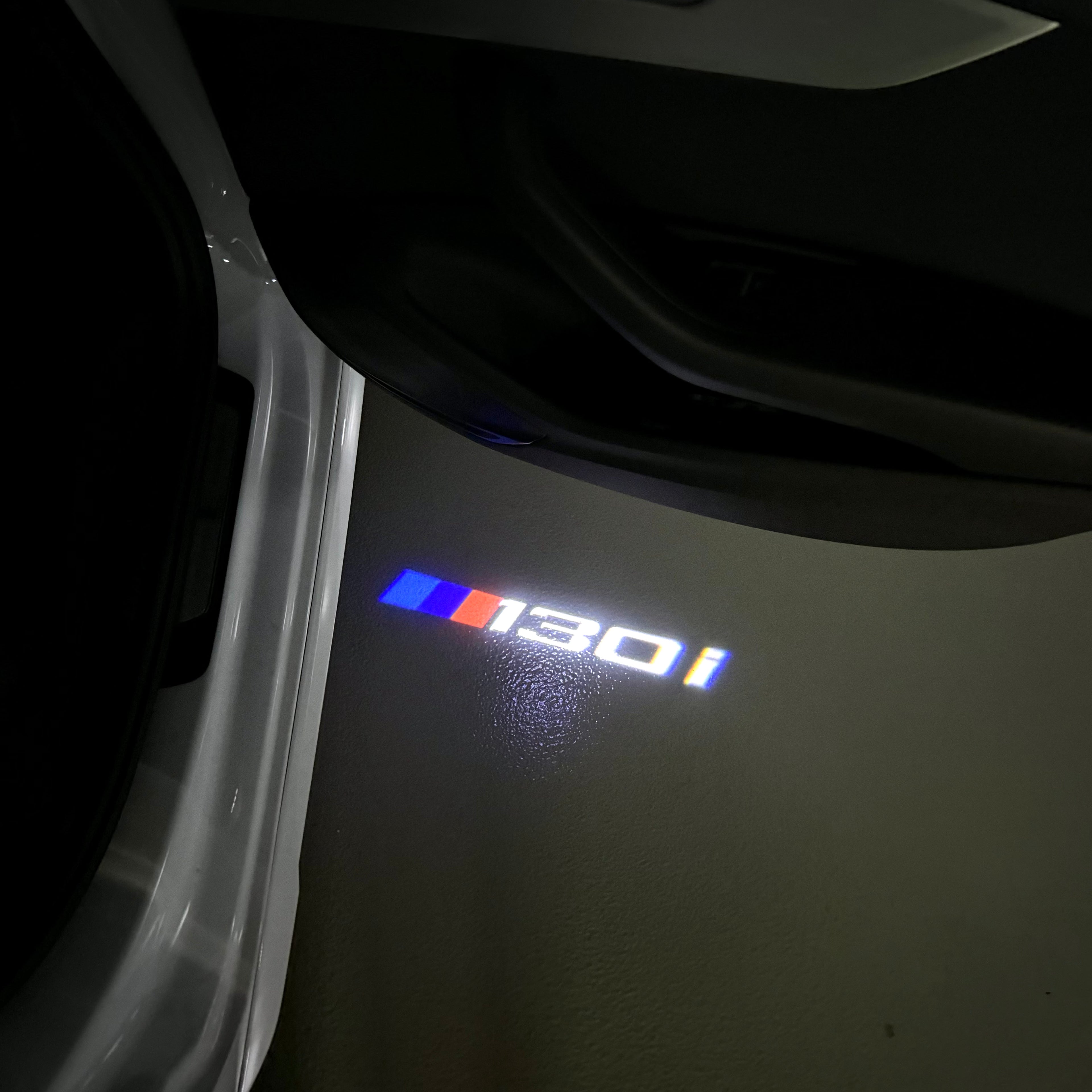 BMW  1 SERIES 130  LOGO PROJECTOT LIGHTS (quantity 1 = 1 sets/2 door lights) Nr.6024t19