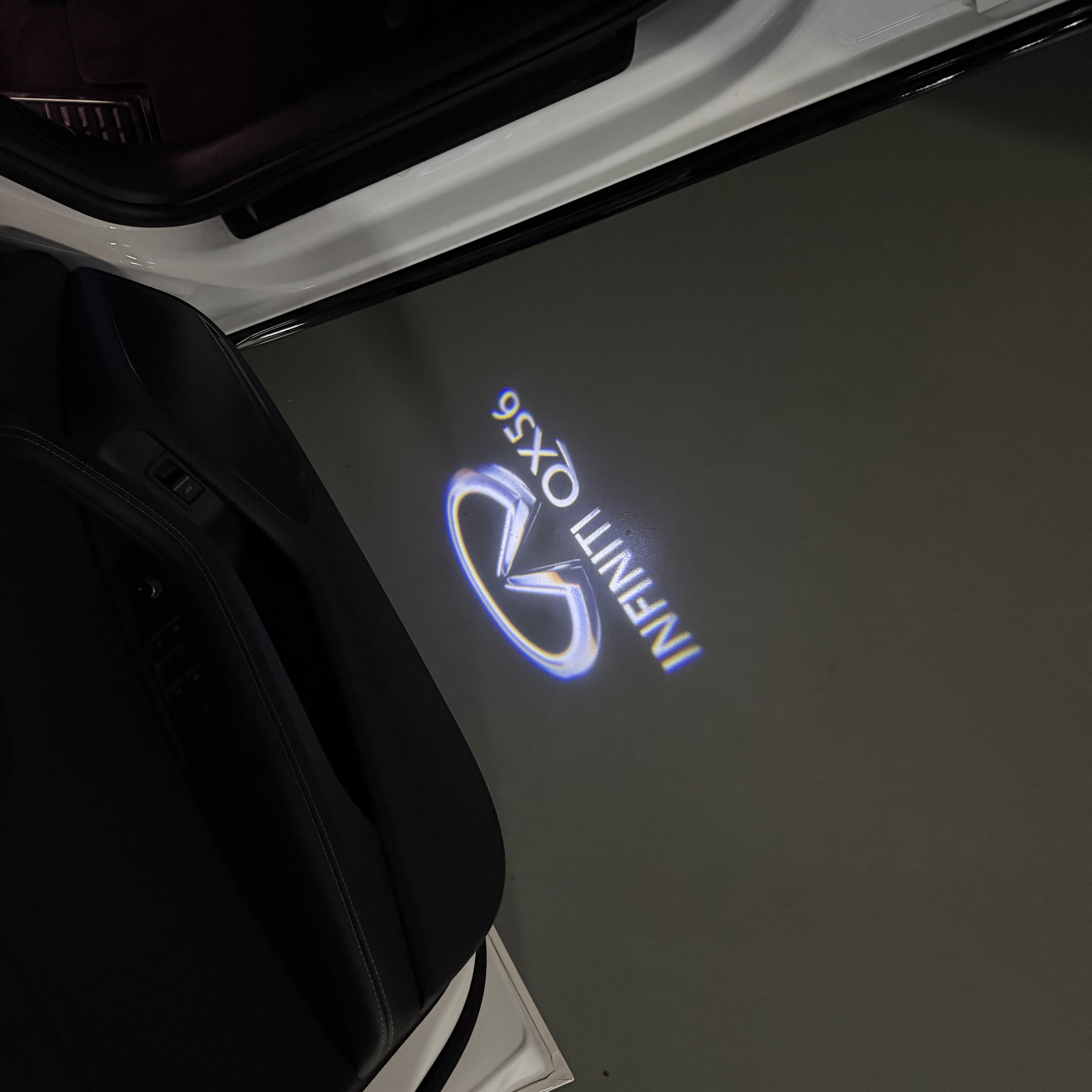 INFINITI  QX56 LOGO PROJECROTR LIGHTS  (quantity 1 = 1 sets/2 door lights)Nr.74A9