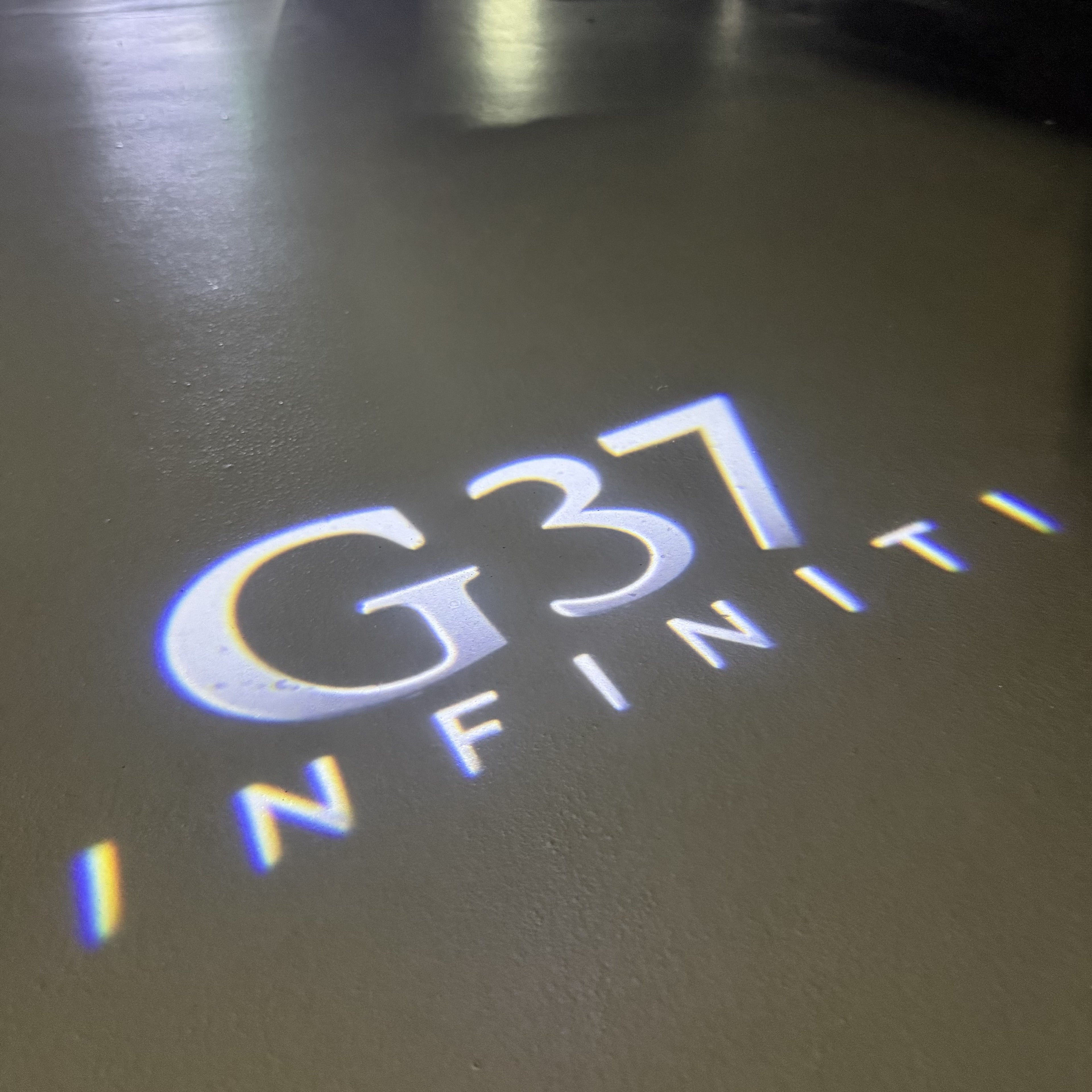 INFINITI  G37 LOGO PROJECROTR LIGHTS  (quantity 1 = 1 sets/2 door lights)Nr.74A62