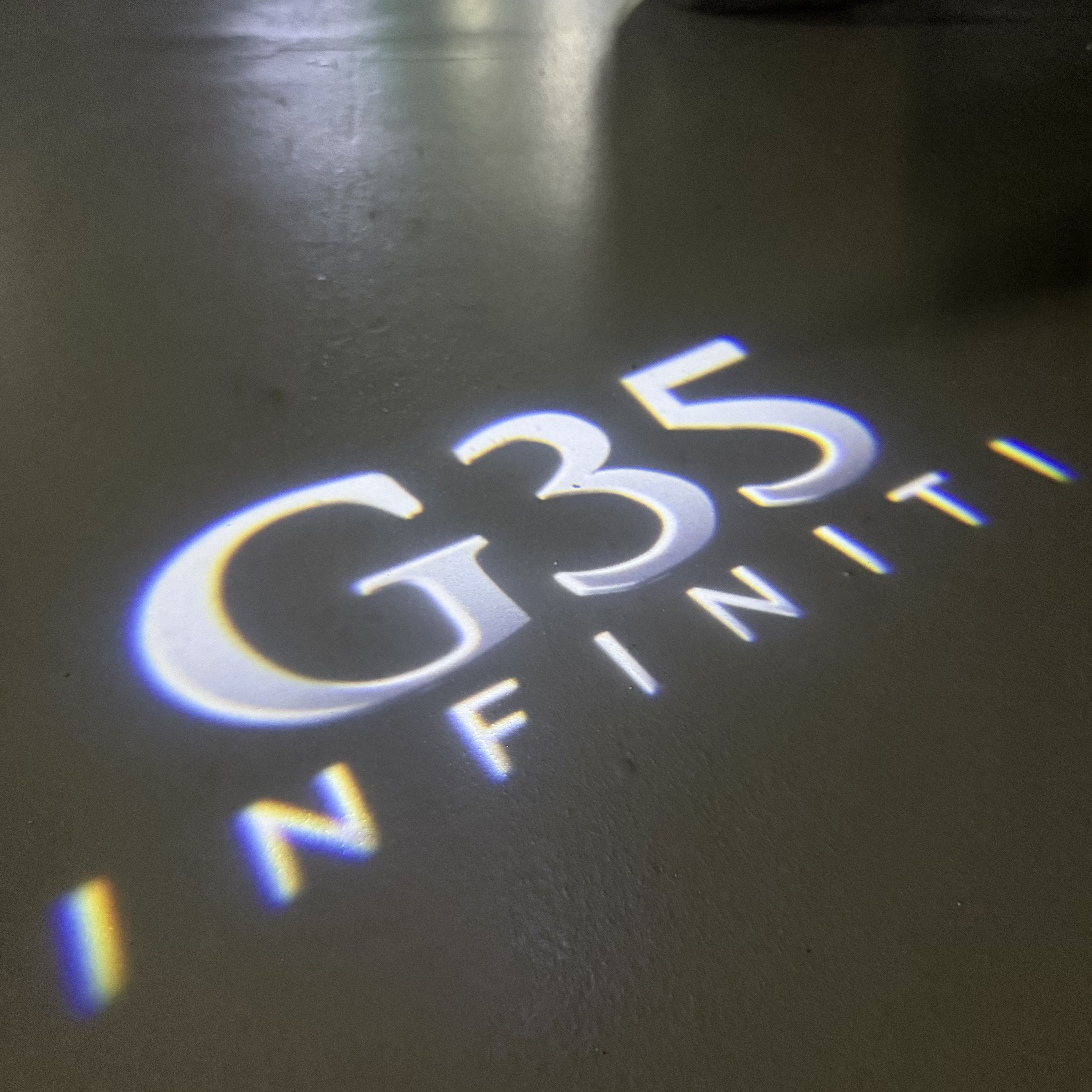 INFINITI  G35  LOGO PROJECROTR LIGHTS  (quantity 1 = 1 sets/2 door lights)Nr.74A56