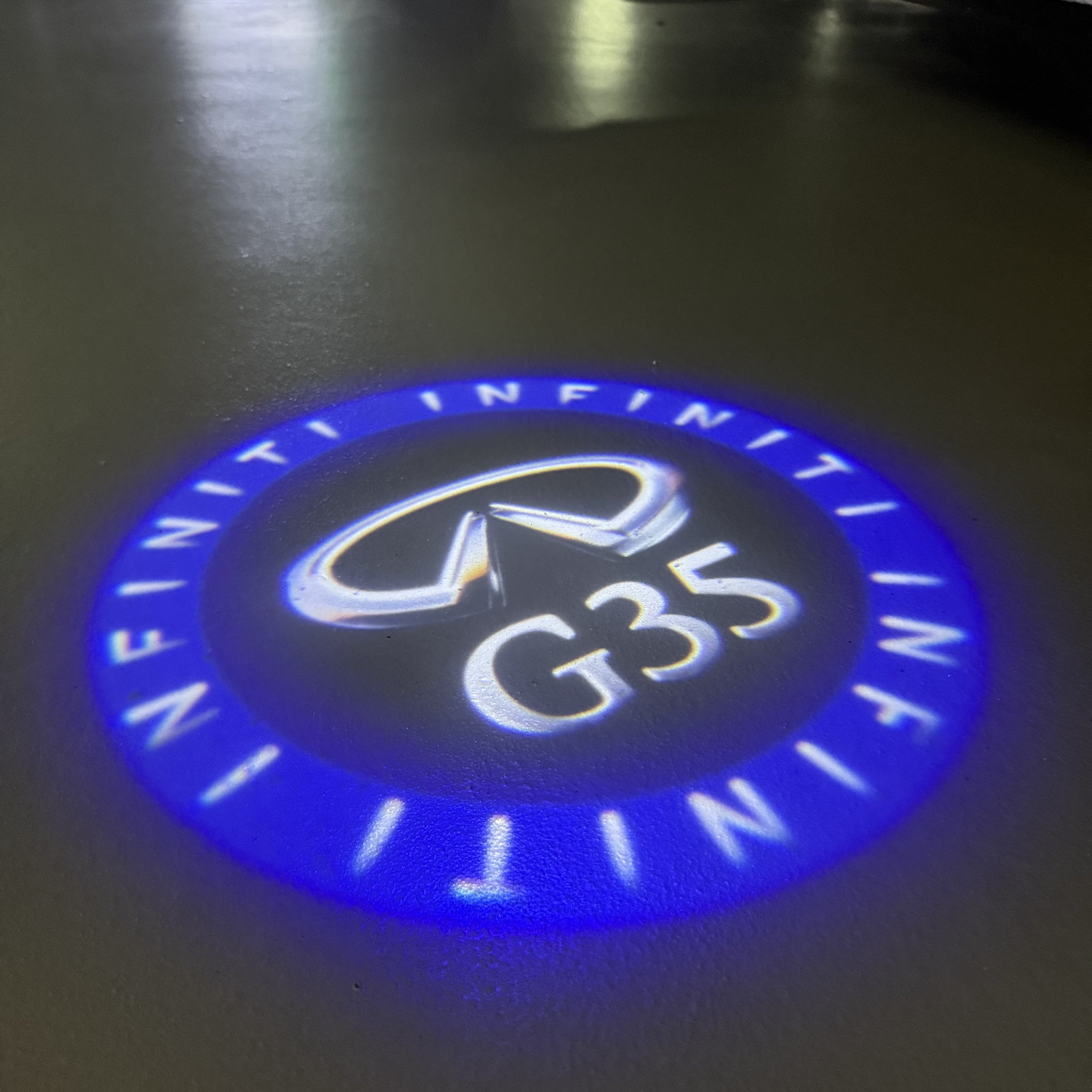 INFINITI  G35 LOGO PROJECROTR LIGHTS  (quantity 1 = 1 sets/2 door lights)Nr.74A58