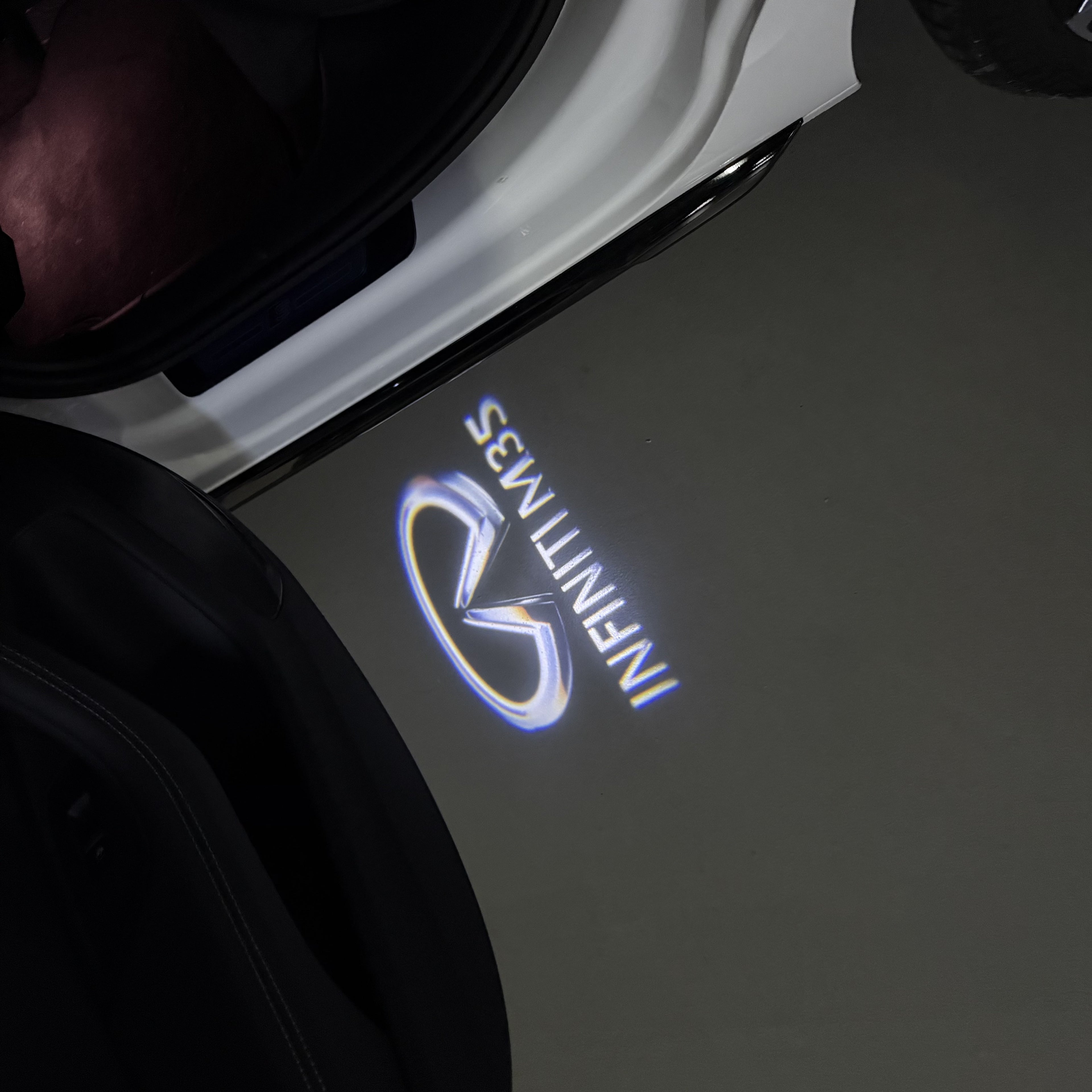 INFINITI  M35 LOGO PROJECROTR LIGHTS  (quantity 1 = 1 sets/2 door lights)Nr.74A91