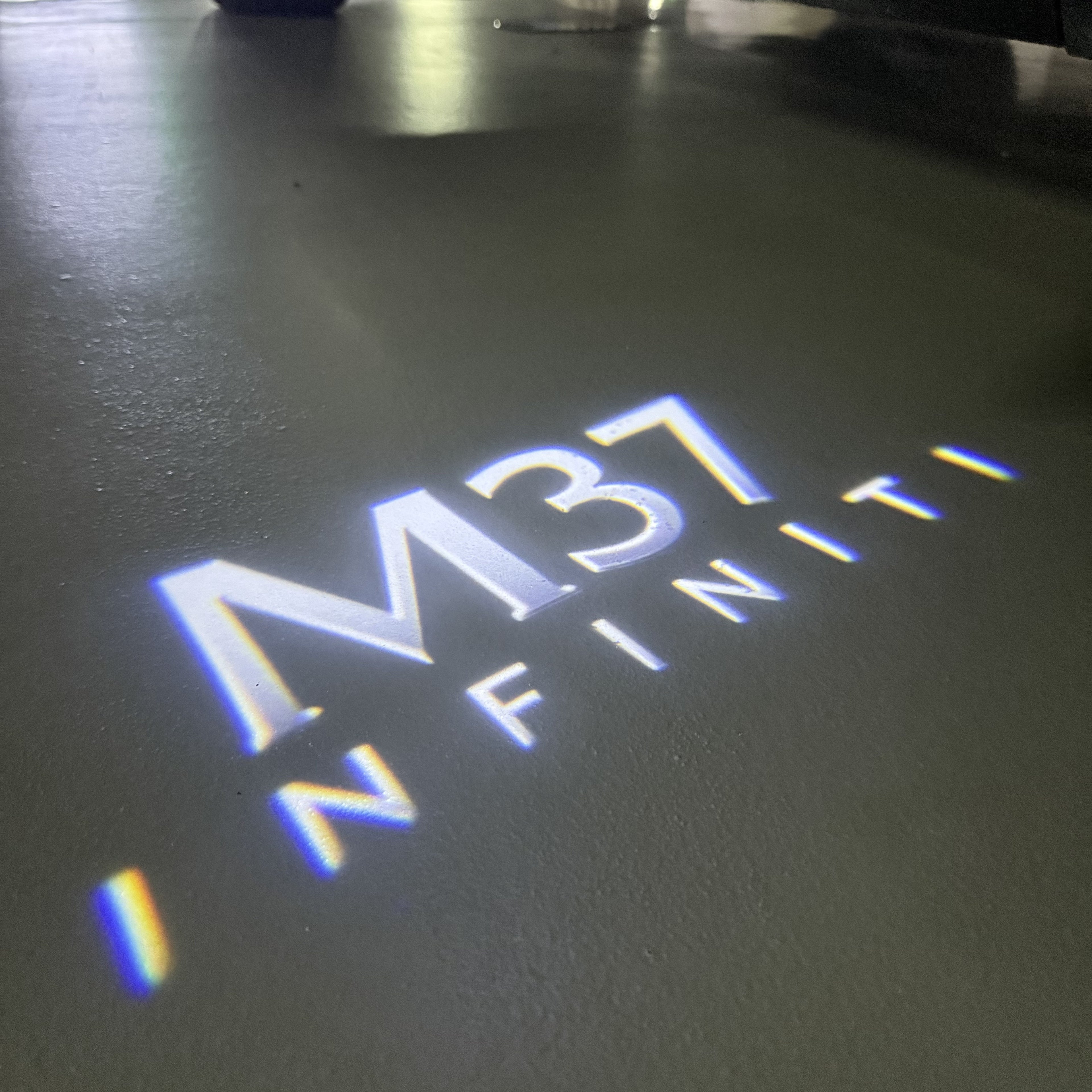 INFINITI  M37 LOGO PROJECROTR LIGHTS  (quantity 1 = 1 sets/2 door lights)Nr.74A87