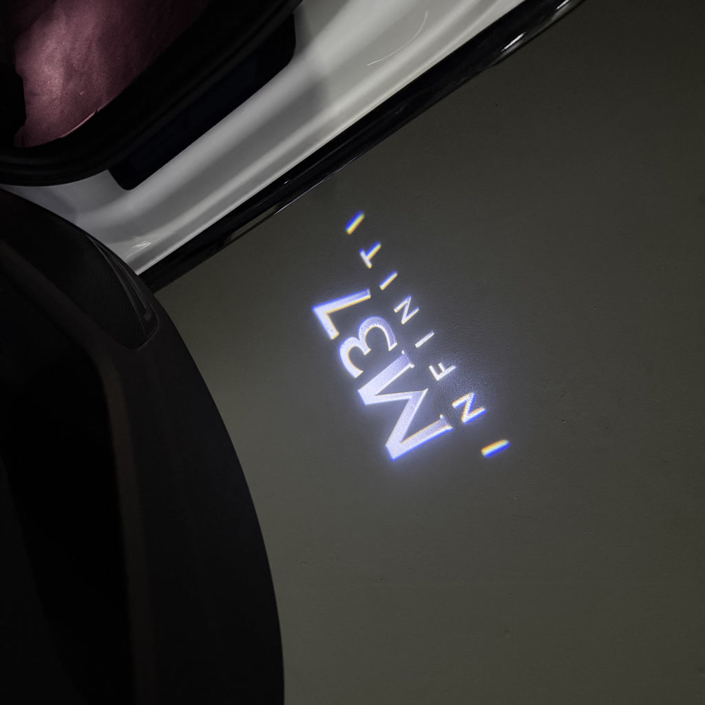 INFINITI  M37 LOGO PROJECROTR LIGHTS  (quantity 1 = 1 sets/2 door lights)Nr.74A87
