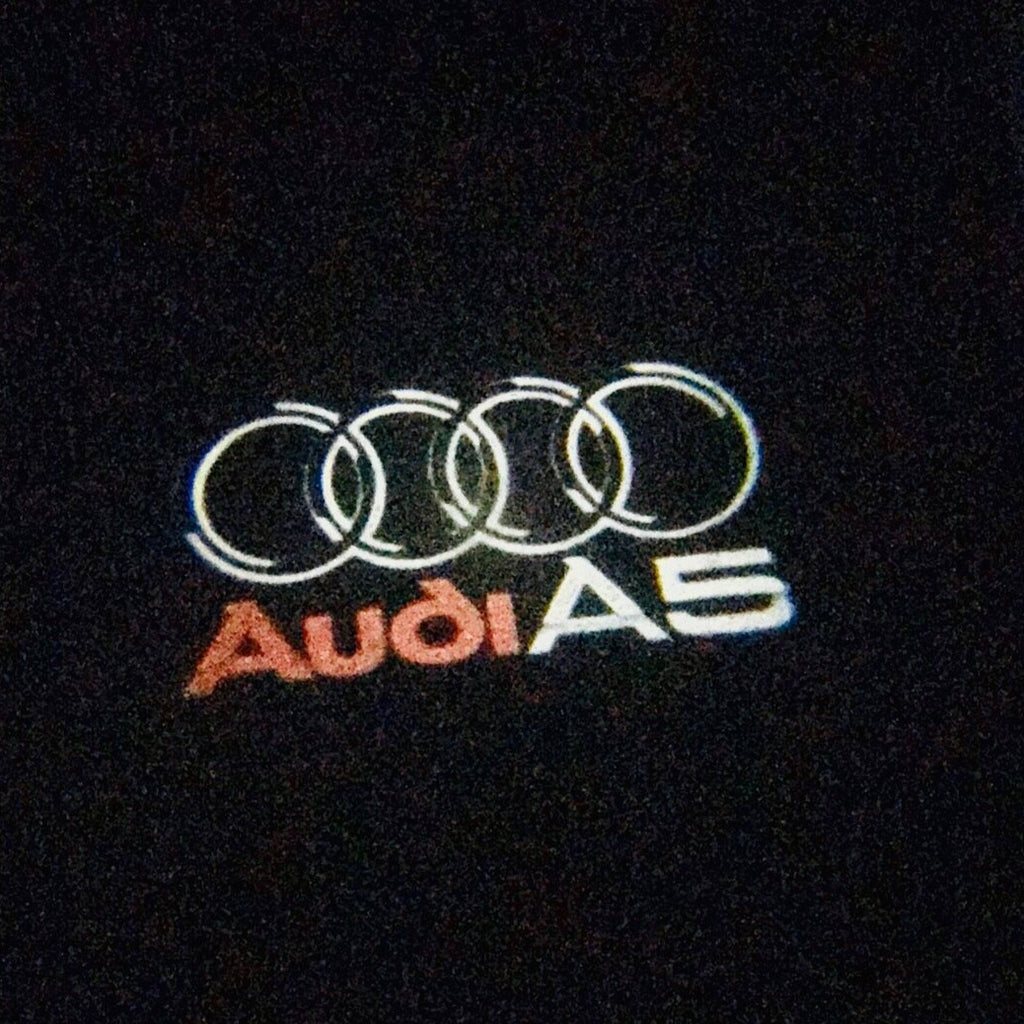 AUDI LOGO PROJECTOT LIGHTS Nr.43 (cantidad 1 = 2 películas con logotipo /2 luces de puerta)