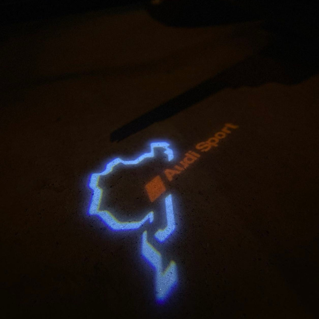 أضواء جهاز عرض شعار AUDI رقم 31 (الكمية 1 = 2 فيلم شعار / 2 مصباح باب)