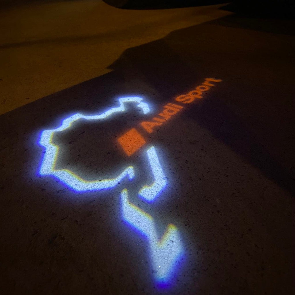 أضواء جهاز عرض شعار AUDI رقم 31 (الكمية 1 = 2 فيلم شعار / 2 مصباح باب)