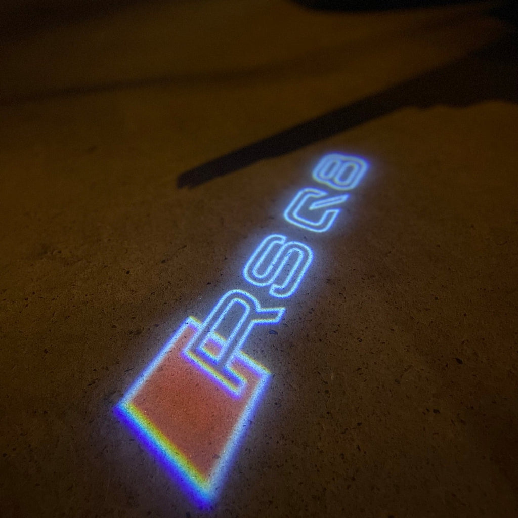 AUDI LOGO PROJECTOT LIGHTS Nr.19 (cantidad 1 = 2 películas con logotipo /2 luces de puerta)