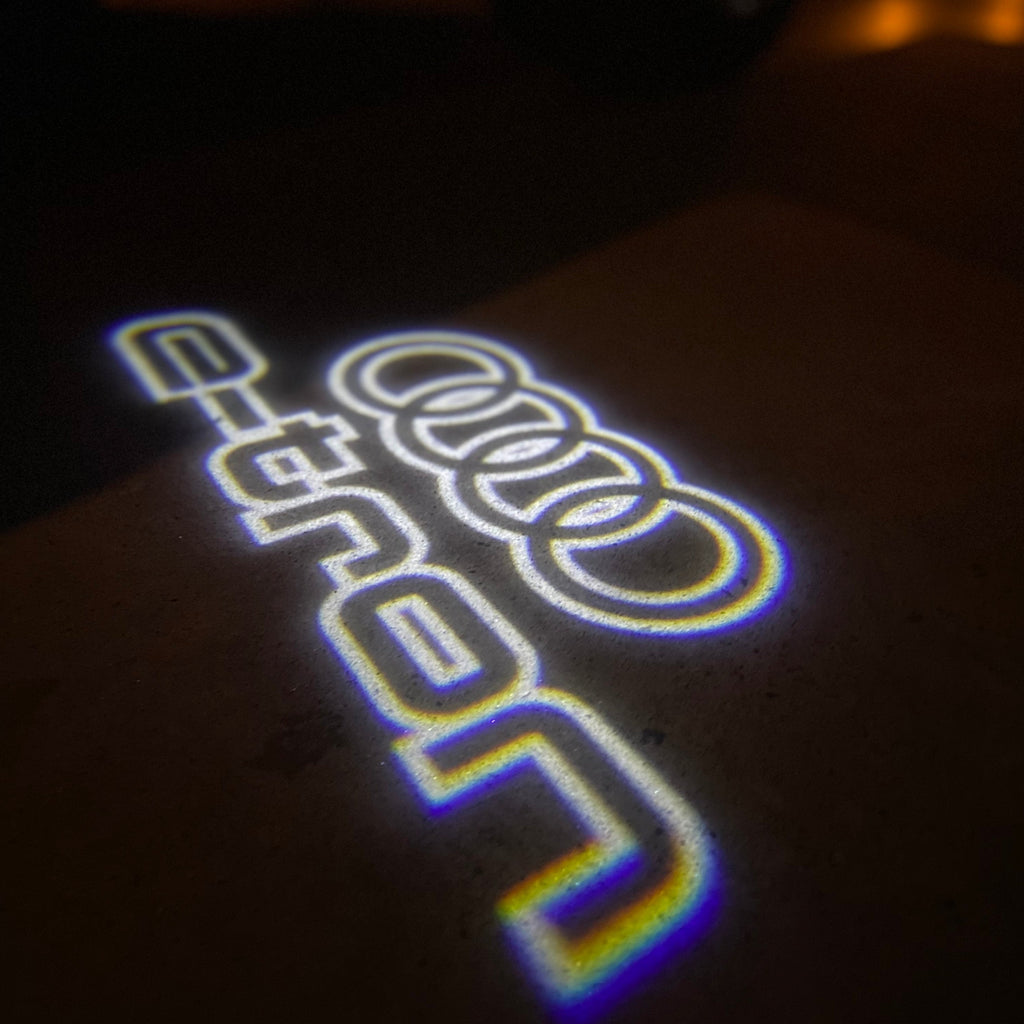 AUDI LOGO PROJECTOT LIGHTS Nr.19 (cantidad 1 = 2 películas con logotipo /2 luces de puerta)