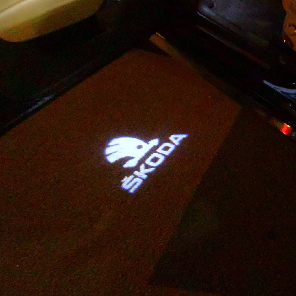 SKODA ORIGINAL LOGO PROJECTOT LIGHTS Nr.10 (quantity  1 =  2 Logo Film /  2 door lights)