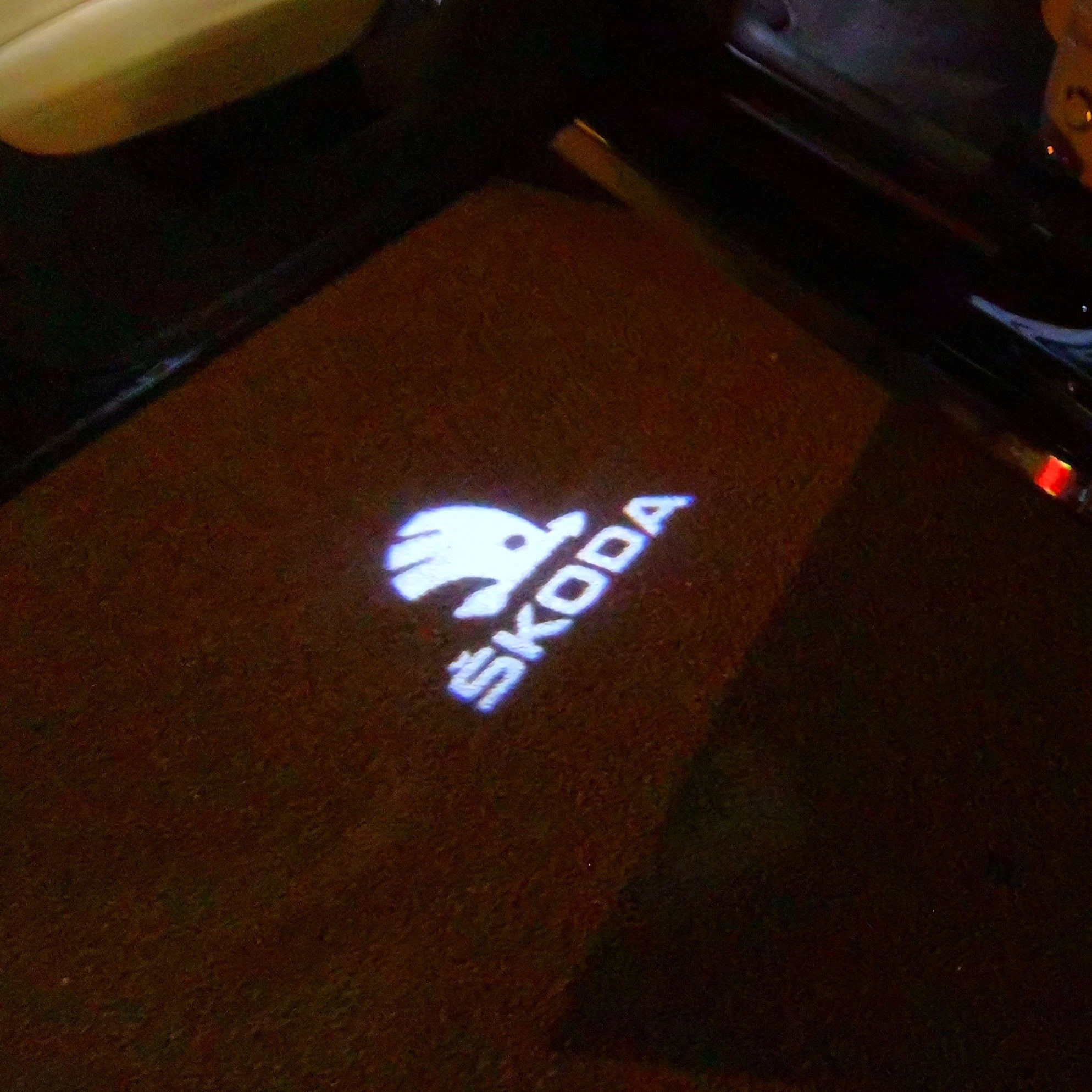 SKODA ORIGINAL LOGO PROJECTOT LIGHTS Nr.10 (quantity  1 =  2 Logo Film /  2 door lights)