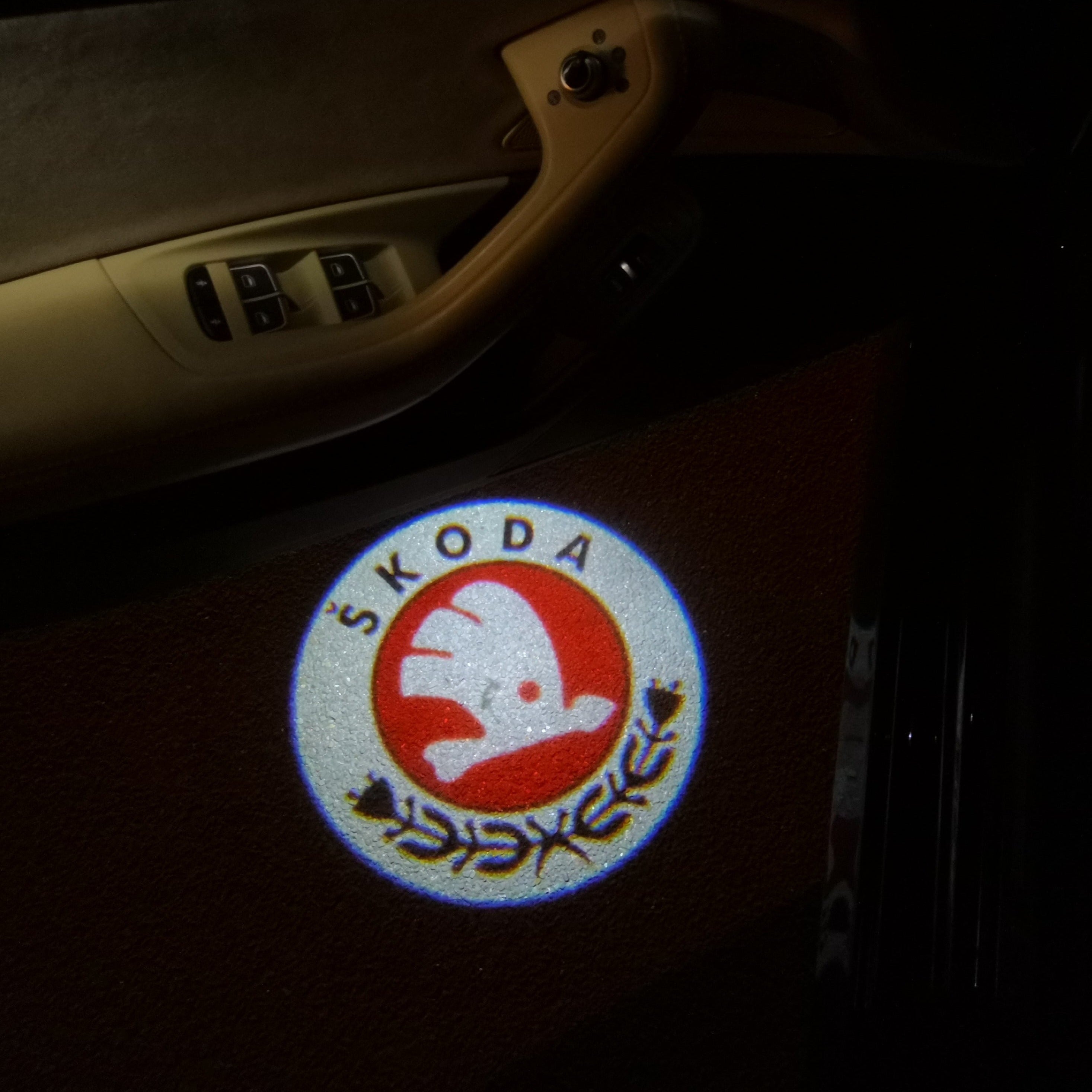 SKODA ORIGINAL LOGO PROJECTOT LIGHTS Nr.12(quantity  1 =  2 Logo Film /  2 door lights)