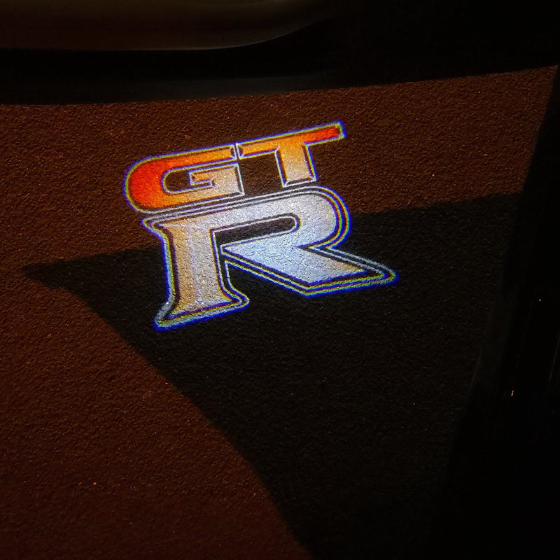 GTR-R35 LOGO PROJECTOT LIGHTS Nr.06 (quantità 1 = 2 Pellicole logo /2 luci porta)