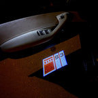 LUCES DE PROYECTOR LOGO AUDI No 153 (cantidad 1 = 2 películas con logotipo / 2 luces de puerta)