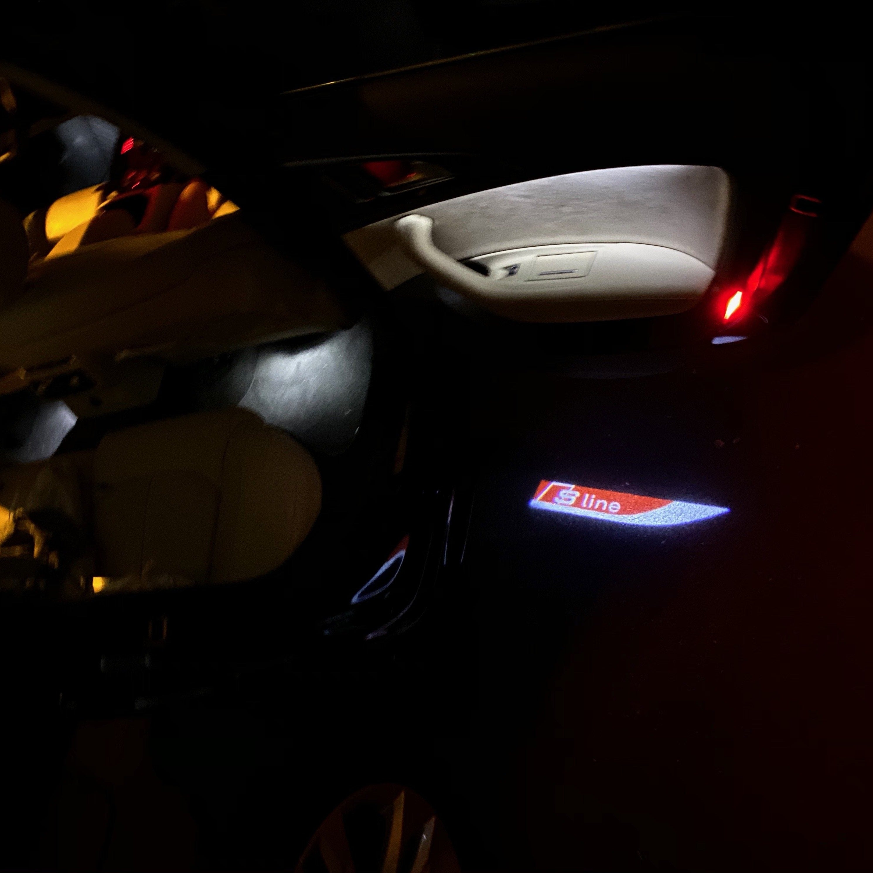 AUDI LOGO PROJECTOT LIGHTS Nr.104 (quantità 1 = 2 Logo Films /2 luci porta)