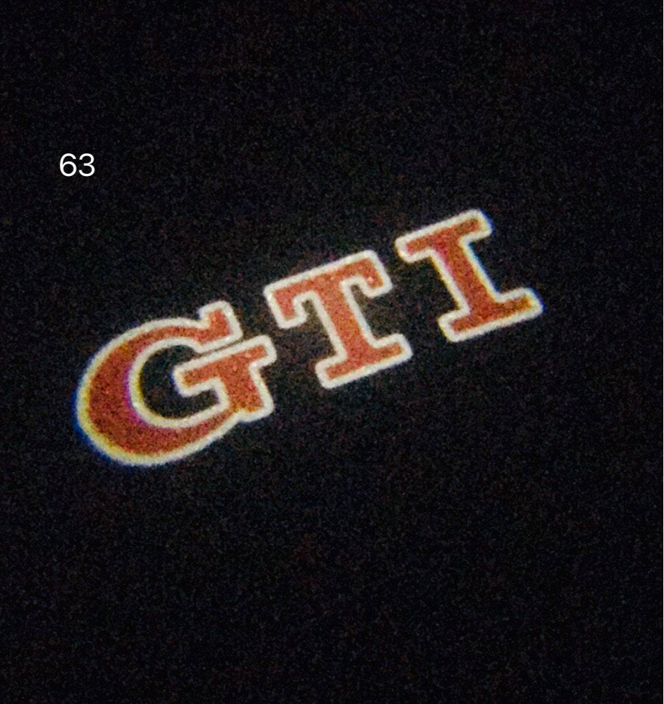 Volkswagen Türleuchten GTI Logo Nr. 29 (Menge 1 = 2 Logofolie / 2 Türleuchten)