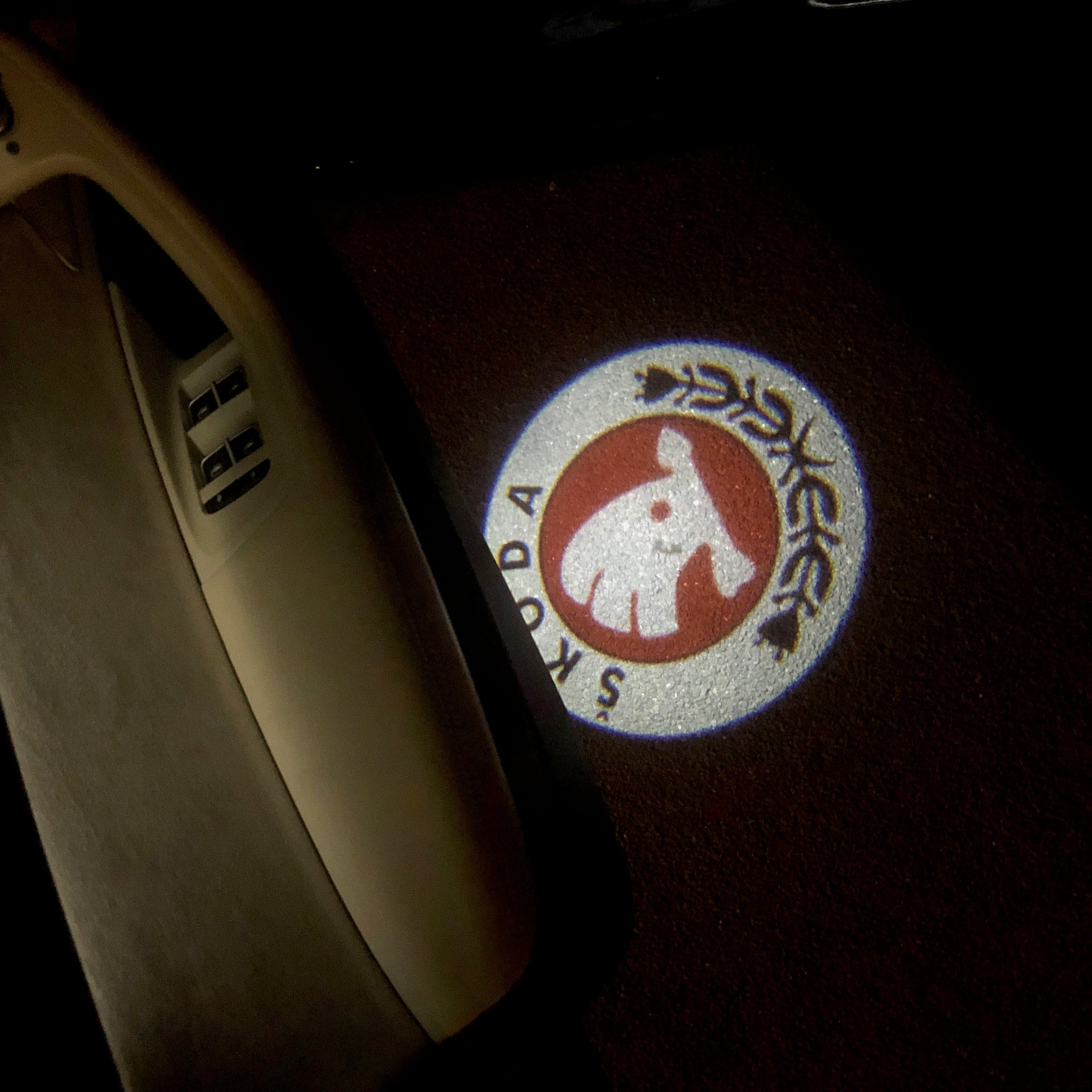 SKODA ORIGINAL LOGO PROJECTOT LIGHTS Nr.12(quantity  1 =  2 Logo Film /  2 door lights)