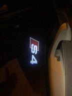 LUCI PROIETTORI LOGO AUDI Nr.25 (quantità 1 = 2 Pellicole Logo / 2 luci porta)
