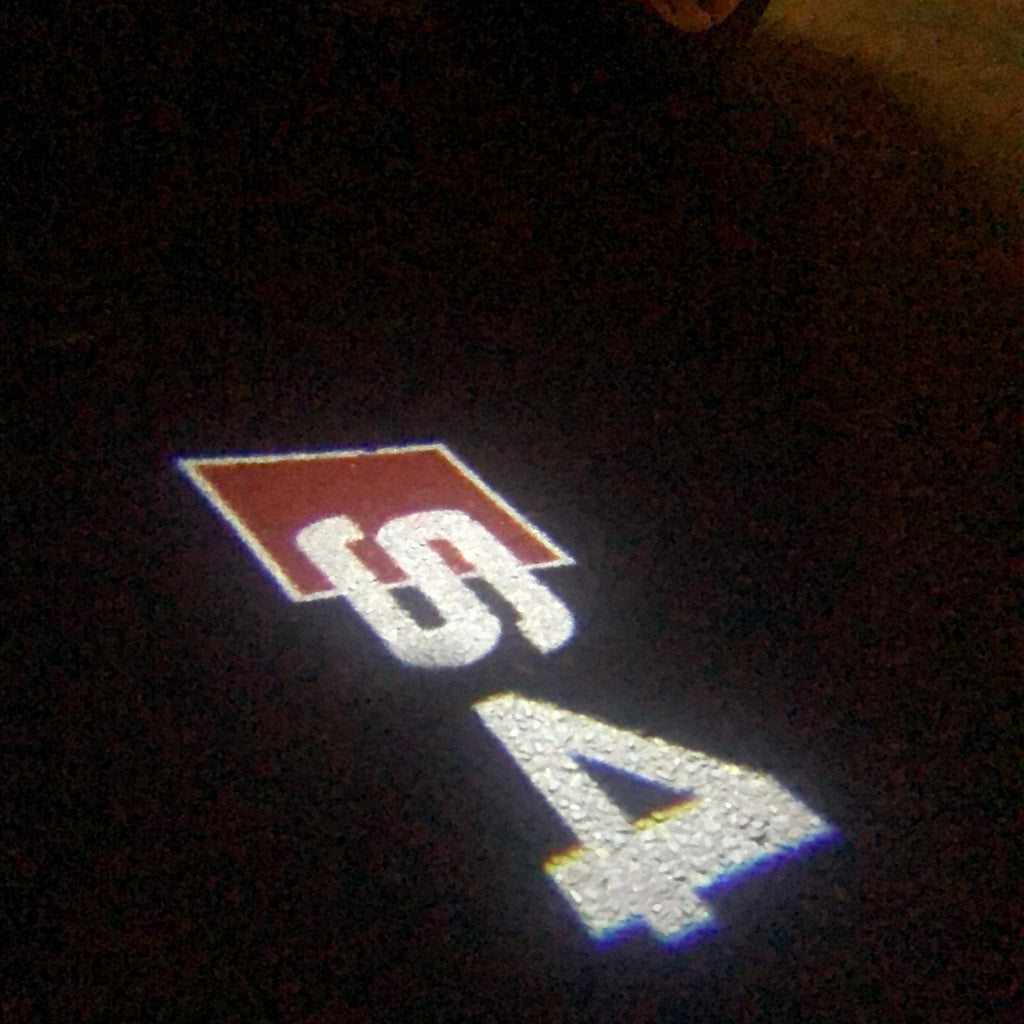LUCI PROIETTORI LOGO AUDI Nr.25 (quantità 1 = 2 Pellicole Logo / 2 luci porta)