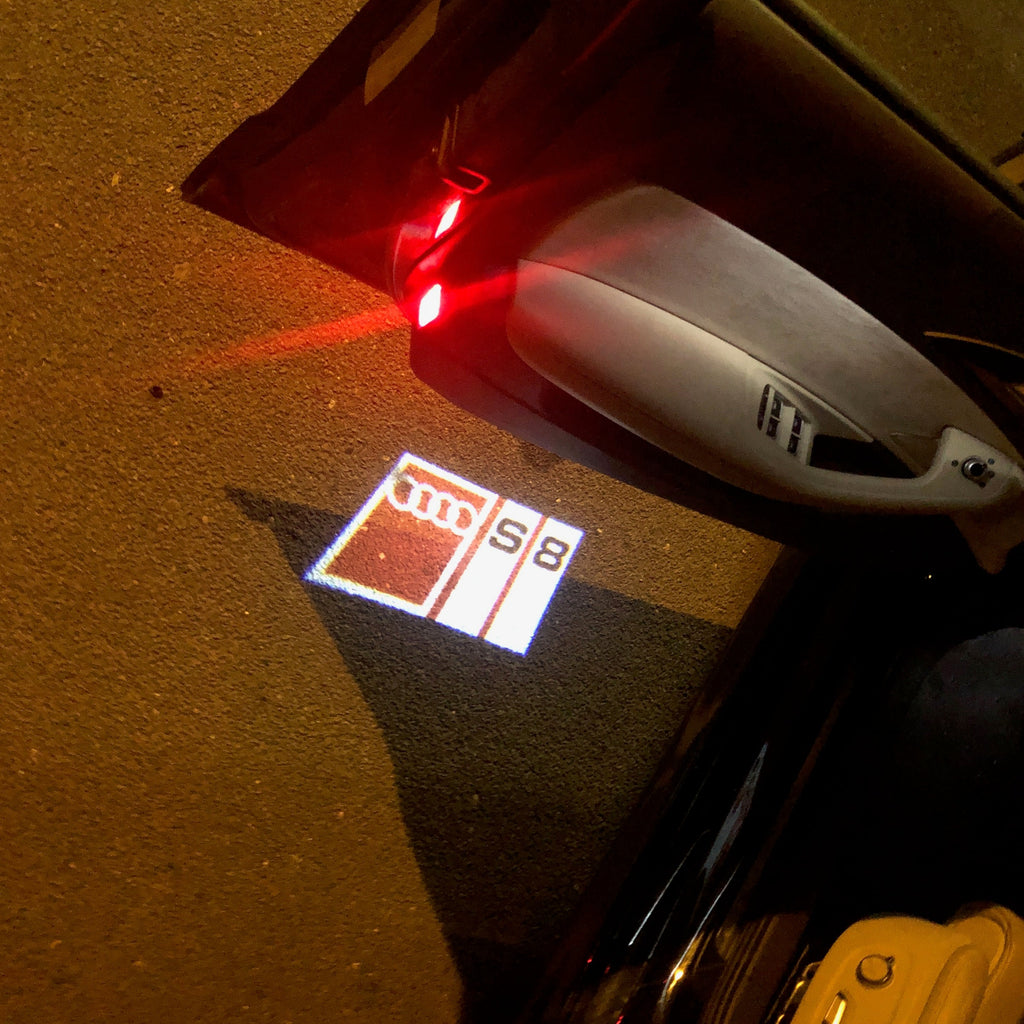 LUCI PROIETTORI LOGO AUDI Nr.149 (quantità 1 = 2 Pellicole Logo / 2 luci porta)