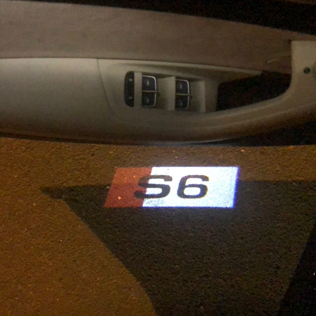 LUCES DE PROYECTOR LOGO AUDI Nr.133 (cantidad 1 = 2 películas con logotipo / 2 luces de puerta)