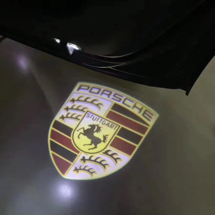 LUCI PROIETTORI LOGO ORIGINALI PORSCHE Nr.03 (quantità 1 = 2 Logo Film / 2 luci porta)